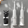Miniatyrbillede 2 af 3: Elektrisk tandbørsteholder vægmonteret tandbørsteholder tilpasser sig 90% elektrisk tandbørsteholder badeværelsestilbehør 1 stk