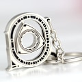 Miniatyrbillede 1 af 2: Spinning Rotor Nøglering Kreativ Bil Fans Autodele Model Wankel Rotationsmotor Nøglering Nøglering Kæde Nøglering Nøgleholder. Polished silve