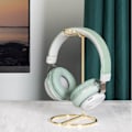 Miniatyrbilde 3 av 5: #Hodetelefonstativ i gullfarge med metallbase#