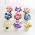 Miniatyrbild 4 av 5: /#/Konstgjord växt grön i kruka Stickade blommor ros 1 st/#/