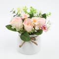 Kunstig blomsterpotte med falske planter og kunstige roser