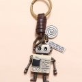 Miniatyrbillede 2 af 5: JewelBeauty Mini Robot Nøglering Kreativt Design 3D DIY Metal Bevægelig Dekoration Læder Nøglering Nøgle Dekoration Nøglering Læder Nøglering Gave til Mænd og Kvinder