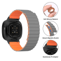 Miniatyrbillede 3 af 5: Til Fitbit Versa 4 / Sense 2 Universal Magnetic Silicone Watch Band Black Orange
