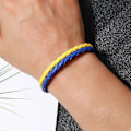 Miniatyrbillede 3 af 5: Blå gul patchwork ukrainsk flag farve armbånd simpelt flettet læderarmbånd, 2024 Ping