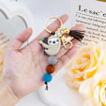 Miniatyrbilde 4 av 5: Dovendyrgaver til kvinner jenter dovendyr nøkkelring ornament ting dovendyr tema dekor silikonperlesmykker med dusk veske charms for dovendyr elsker – Håndveske,