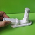 Miniatyrbilde 2 av 5: 2 stk. Barnesikring dørhåndtakstopper med knappdesign Dør- og vindushåndtakholder