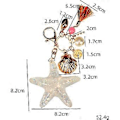 Miniatyrbilde 4 av 5: Sølv Kors Rhinestone Nøkkelring Sjarmpendant Veske Håndveske Krystall Nøkkelholder Kunst Håndverk Pendant Inspirasjon Nøkkelring (sjøstjerne & skall)