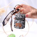 Miniatyrbillede 1 af 2: Moderig mini luksushovedtelefonpose alsidig nøglering vedhæng high-end fuld diamant Black Diamond