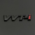 Pikkukuva 5 / 5: 3D Metallinen Musta VVTi Logo Kirjaimet Auton Lokasuojan Merkki Takaluukun Merkki Toyota Camry Corolla Yaris RAV4 Auris VVTI Tarra Lisävarusteet