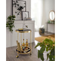 Miniatyrbillede 3 af 5: Rootz designvogn guld rund Ø 45cm 2 plan - Sidebord på hjul med glasplade Sort spisevogn - Køkkenvogn - tevogn