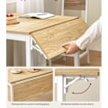 Miniatyrbillede 5 af 6: Rootz spisebord til 2-4 personer - Naturlig egefarve - Skyhvid - Spånpladestål - 78 cm x 120 cm x 76,2 cm - Bærbart foldbart bord
