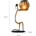 Miniatyrbild 2 av 4: Smidesjärnsljusstake, smidesjärnsljusstake i form av en liten flicka
