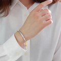 Miniatyrbillede 2 af 2: Justerbart armbånd i rustfrit stål - guld og sølv (0,5 cm bredde)" Gold one size