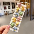 Pikkukuva 2 / 2: Sarja värikkäitä hauskoja hahmoja tupsut kuminauhat sammakkomehiläinen kani Multicolor one size