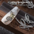 Pikkukuva 4 / 8: 10 kpl DIY Nail Art Decoration 3D Sliver / kultainen rusetti kynsipora 10Pcs Sliver 7*18mm