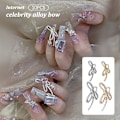 Pikkukuva 2 / 8: 10 kpl DIY Nail Art Decoration 3D Sliver / kultainen rusetti kynsipora 10Pcs Sliver 7*18mm