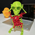 Miniatyrbilde 2 av 5: 3D Dansende Svingende Vind-Opp Skjelett Leke Moteskrivebordsdekorasjon for Studerom Kontor  (FMY) Red and Green 17cm