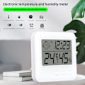 Miniatyrbillede 4 af 7: Smiling Fa Temperatur- og Fugtighedsmåler Indendørs Husholdningsvejrstation LCD Digitalt Termometer Hygrometer Med Vækkeur White