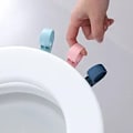 Miniatyrbillede 1 af 5: 3 stk. Toiletlåg Håndtag Løfter Toilet Sæde Løfter Håndtag Klæbende Toilet Dæk Løft Værktøj til Badeværelse Hotel Hjem Kontor Undgå at Røre Toilet Dæk Mult