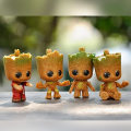 Miniatyrbillede 2 af 4: 4 stk./sæt Miniature Fe-have Siddende Groot Figur PVC Statue Groot til Børn Hjem Bil Dekoration Gave
