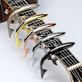 Miniatyrbild 4 av 4: Gold Tyrant - Zinklegering Gitarrhaj Capo för Akustisk och Elektrisk Gitarr