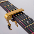 Miniatyrbild 4 av 5: Ukulele Capo, Gitarr Capo för Akustisk Gitarr Elgitarr Folkgitarr Bas Ukulele Banjo Mandolin, Gitarrtillbehör, Svart