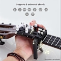 Miniatyrbild 2 av 5: Bärbar Ukulele Finger E x erciser Gitarrackord Träningsverktyg för Nybörjare