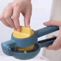Miniatyrbillede 3 af 4: Manuel Citronpresser med Langt Håndtag i Metal til Effektiv Udtrækning af Citrussaft