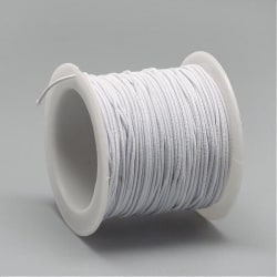 Rulle  c:a 20 mt. Vit nylonklädd elastisk tråd 1,0 mm.
