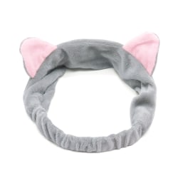 Ett öronband för grått kattöra för tvätt eller smink