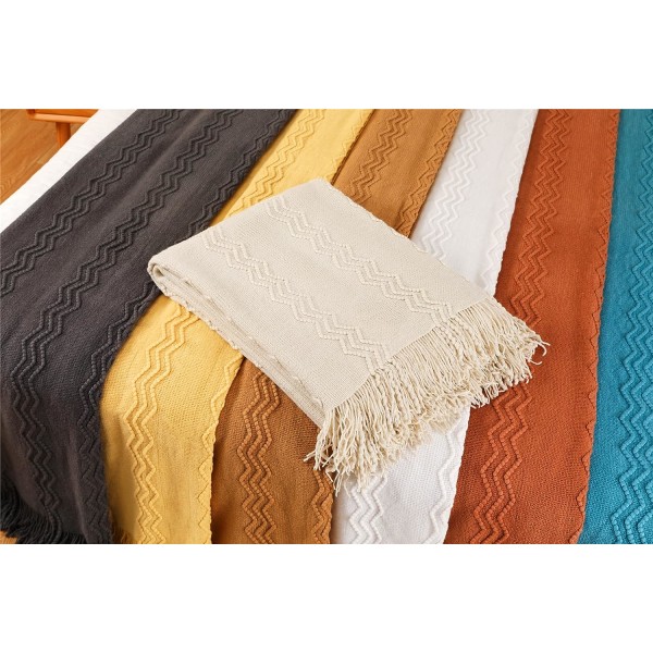 Boheme blød strikket tæppe med pompom beige - 127*17