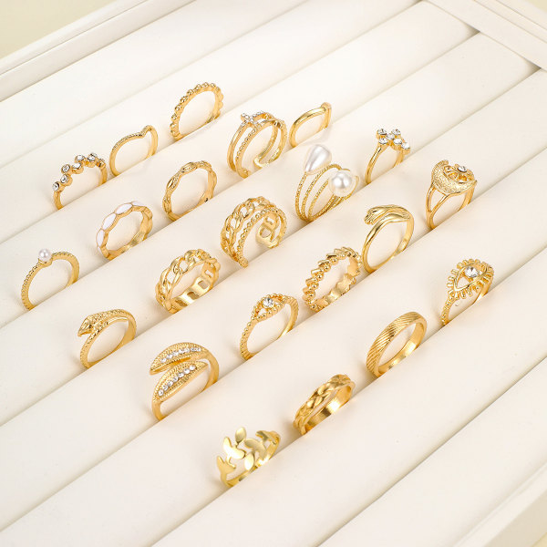 23 uppsättningar av kvinnors smycken, spiral falska pärlor kärleksringar med cre