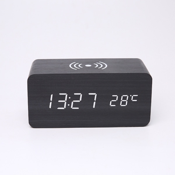 Et sort digitalt LED-ur, 150 mm × 70 mm × 70 mm trådløs opladning