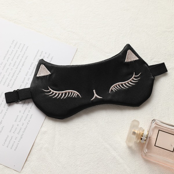 Eine mysteriöse schwarze Seidenschlaf Gesichtsmaske Katzenaugenma
