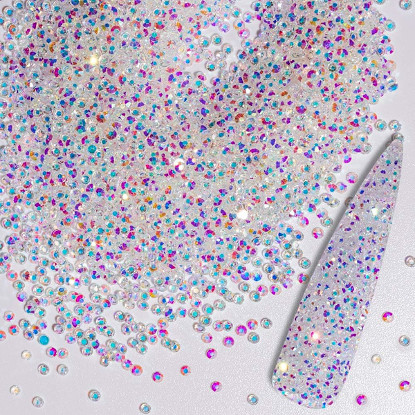 Et sæt med 10.000 1,2 mm regnbuefarvede glas mini-rhinestones til kreativitet