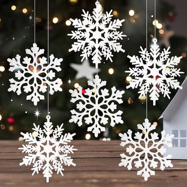 Set med 24 julunderlägg med 4 röda snöflingemönster