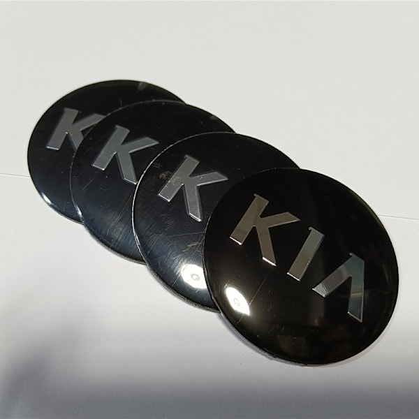 Sett med svarte Kia bilhjulkapsler 60mm 4-pakning for P