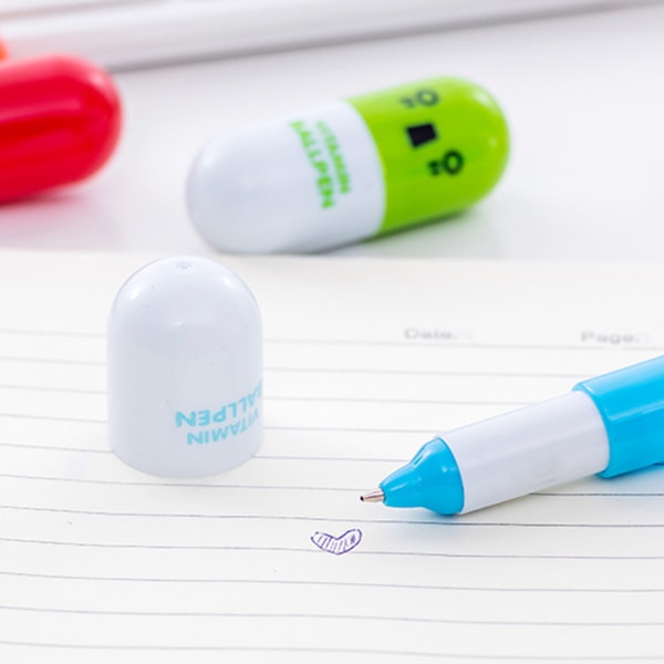 Piller-formade pennor Smidigare skrivande Infällbar mini-bärbar söt tecknad piller-formade pennor för klassrumspresenter