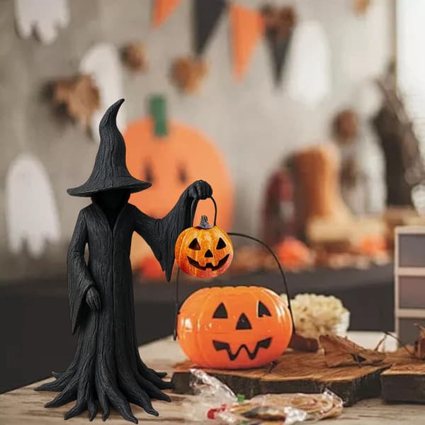 Heksefigur til Halloween, heksefigur med en spand