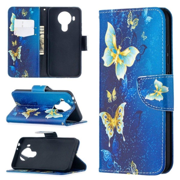 Wonderland Nokia 5.4 Flip etui - Gylden sommerfugl Blue