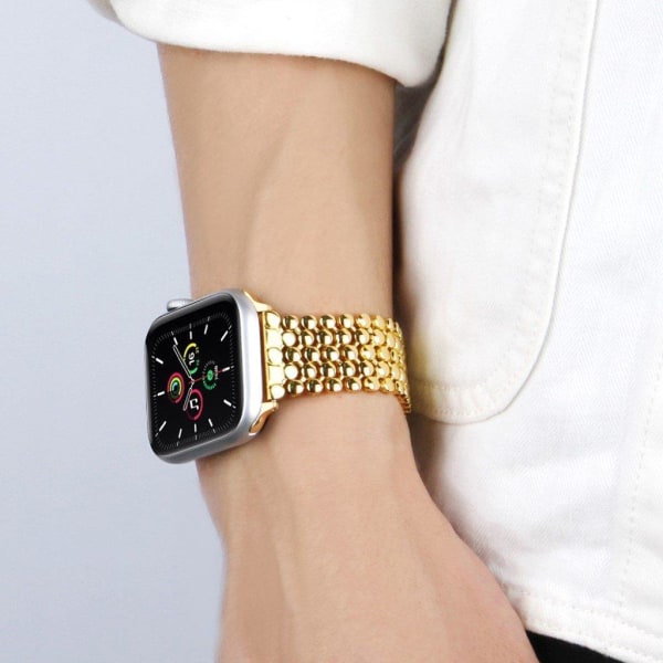 Apple Watch 44 mm klockarmband i honungskaka-aluminium - Guld Guld