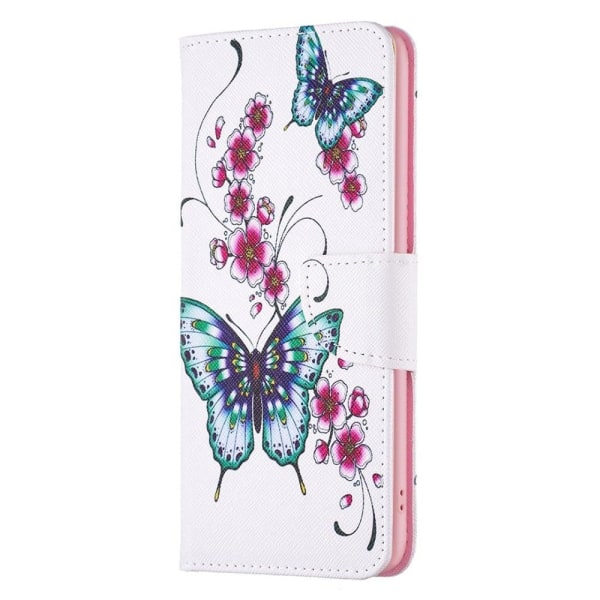 Wonderland iPhone 14 flip etui - Ferskenblomst Og Sommerfugle Multicolor