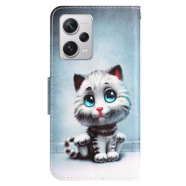 Wonderland Xiaomi Poco X5 Pro / Redmi Note 12 Pro / 12 Pro Speed Flip Etui - Blå Øjne Kat Blue