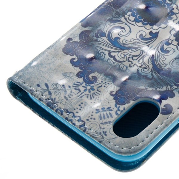 iPhone Xr light spot decor læder flip cover - Blomstret Kranie Blue