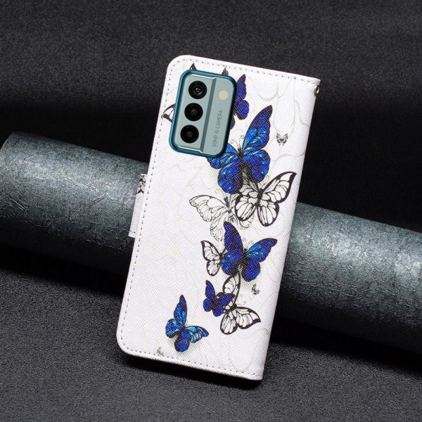 Wonderland Nokia G22 Flip Etui - Sommerfugle Blue