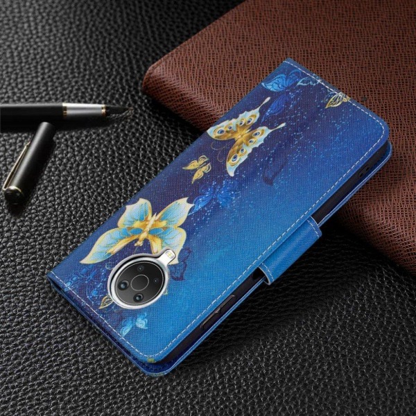 Wonderland Nokia G20 Flip etui - Guld sommerfugle Blue