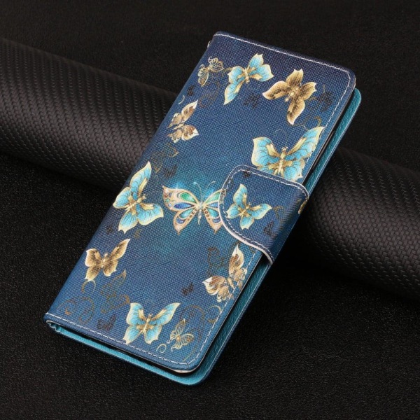 Wonderland iPhone 13 Pro flip etui - Sommerfugle Som Smykke Blue