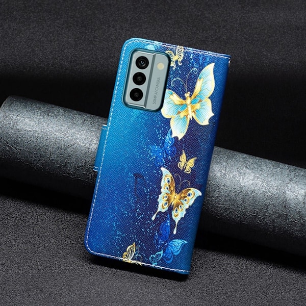 Wonderland Nokia G22 Flip Etui - Gyldne Sommerfugle Blue