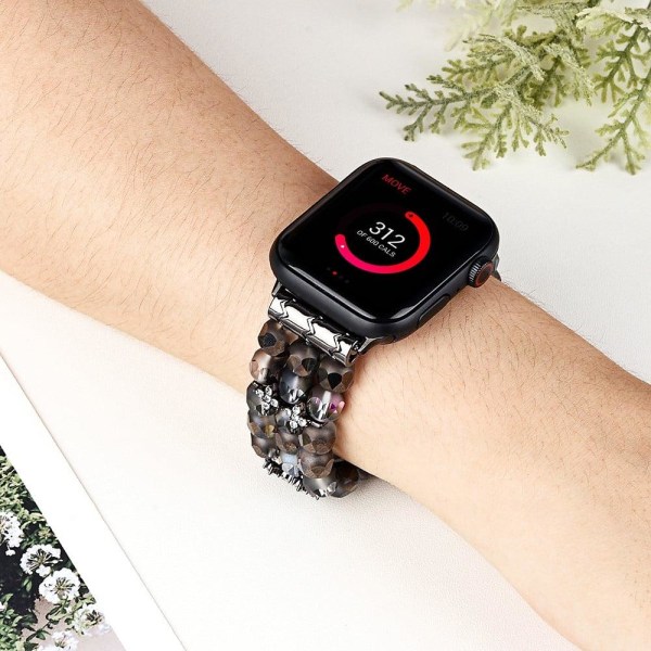 Apple Watch (41mm) klockarmband med kristalldekor i form av en blomma - Svart Svart