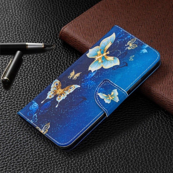 Wonderland Xiaomi Redmi 9 Flip etui - Blå og guld sommerfugl Blue